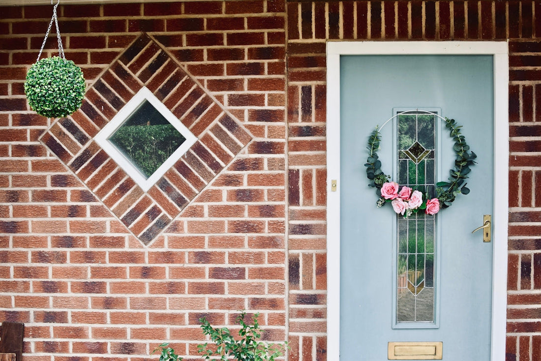 white wooden window with red flowers